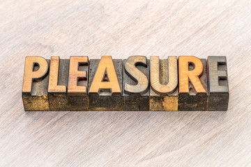 pleasure word abstract in wood type