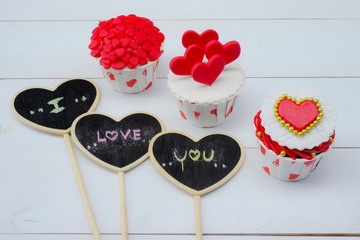 Cupcakes with small hearts . Romantic love background. Happy Valentines Day. St. Valentine's Day theme.
