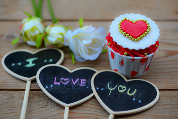 Cupcakes with small hearts . Romantic love background. Happy Valentines Day. St. Valentine's Day theme.
