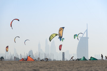 Kite surf kites flying over Jumeirah public beach in Dubai, UAE.