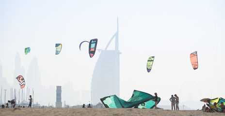 Kite surf kites flying over Jumeirah public beach in Dubai, UAE.