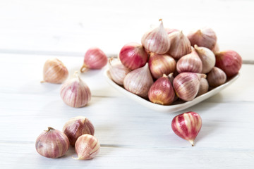 Fresh healthy garlic on white table