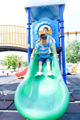 Young asian boy at out door playground