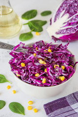 Obraz na płótnie Canvas Fresh red cabbage salad with corn. Vegeterian and diet food