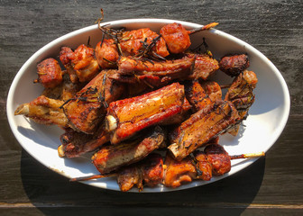 Grilled meat on white dish