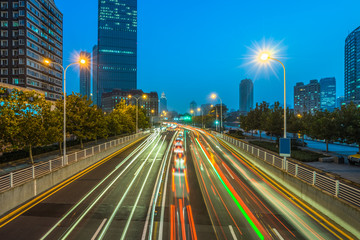 Fototapeta na wymiar moving car with blur light through city at night
