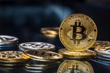 Bitcoin. Golden and silver bitcoins - virtual cryptocurrency