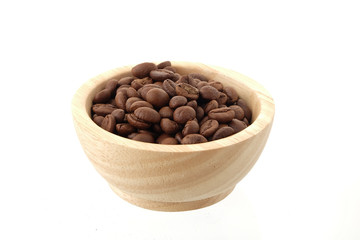 coffee seeds in Wooden bowl Isolated on white background.