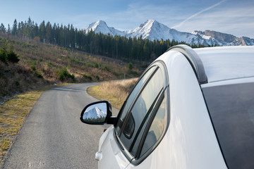 White, modern SUV on the mountain road