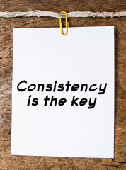 The words consistency is the key on background 