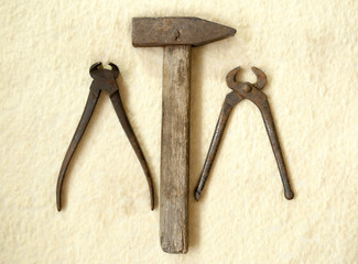 old hammer and two old nippers