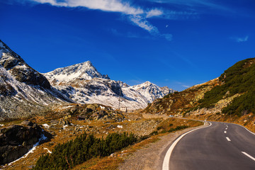 Fototapeta premium Landscape of the Swiss Alps and forest of national parc in Switzerland. Alps of Switzerland on autumn. Fluela pass road. . Swiss canton of Graubunden. Val Müstair Region