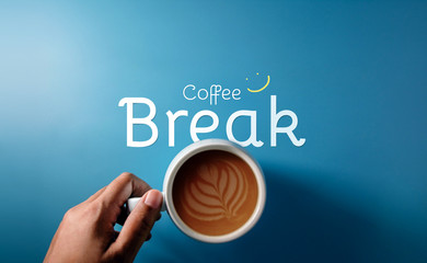 Coffee Break Concept in Work, Meeting and Life, Top view of Hand holding a Cup of Latte with Text...