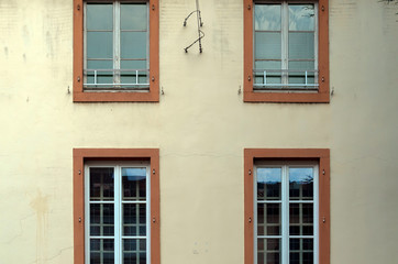 Fototapeta na wymiar Full Frame Shot of Windows on the Exterior Wall of the Sainte Chrétienne Institution in Sarreguemines, France