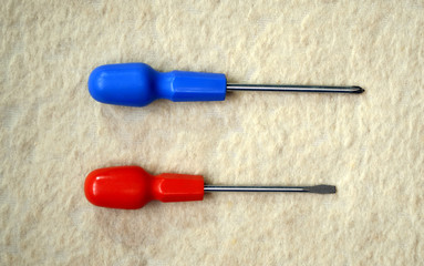 two screwdrivers with a red and blue handles