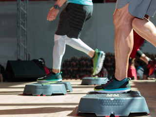Fitness Workout in Gym: Man doing Exercises with Step Platform