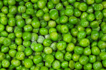 Frozen pea peases texture background. Green pease background pattern. Green peas.