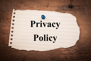Privacy policy on torn paper background 