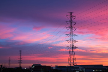 Fototapeta na wymiar High voltage poles on sunset.