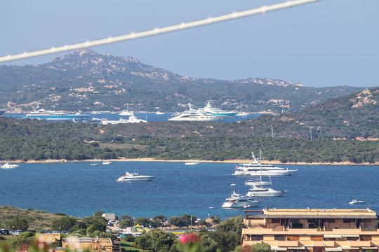 Luxury yachts at Porto Massimo bay at Sardinia Island, Italy..