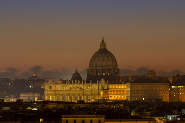Fototapeta premium Panorama view of Rome at sunset with St Peter Cathedral