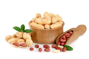 peanuts with leaf in wooden bowl isolated on white background