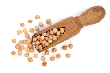 Dry raw organic chickpeas in a wooden scoop isolated on white background. Top view