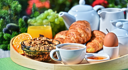 Breakfast served with coffee, juice, croissants and fruits