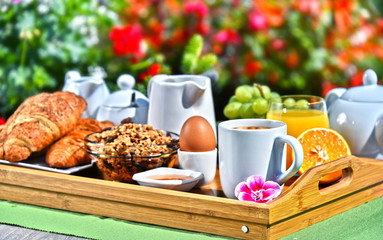 Breakfast served with coffee, juice, croissants and fruits