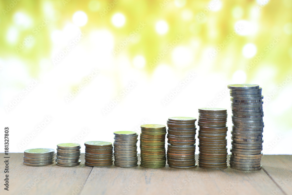 Poster coin stack with blur light dreamy bokeh background. business, finance and saving concept.