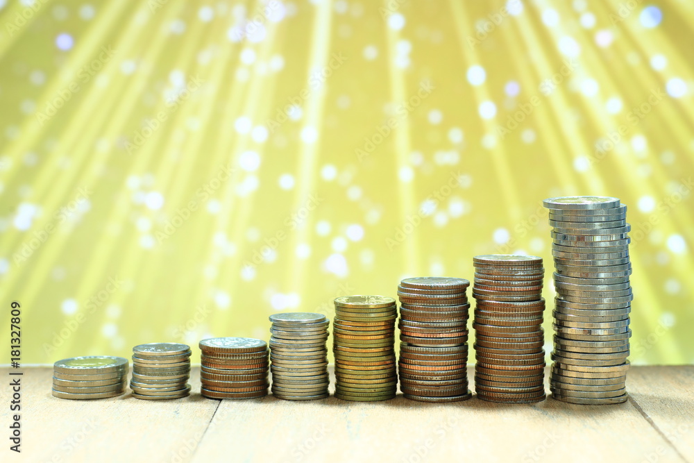 Poster coin stack with blur light dreamy bokeh background. business, finance and saving concept.