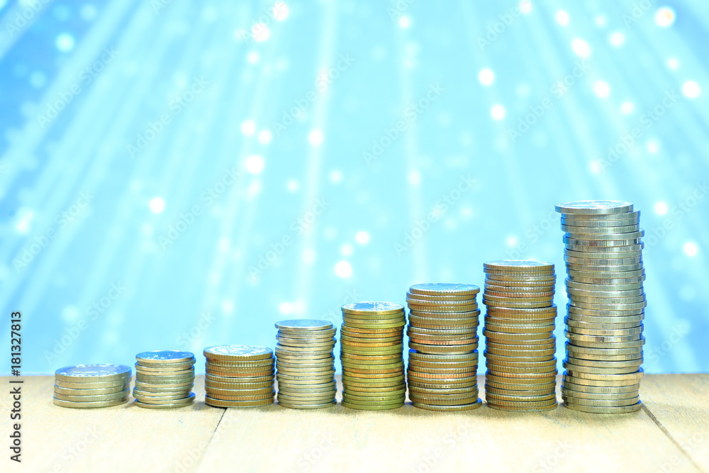 Poster coin stack with blur light dreamy bokeh background. business, finance and saving concept.