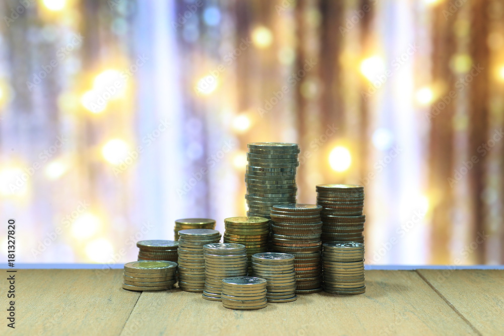 Poster coin stack with blur light dreamy bokeh background. business, finance and saving concept.