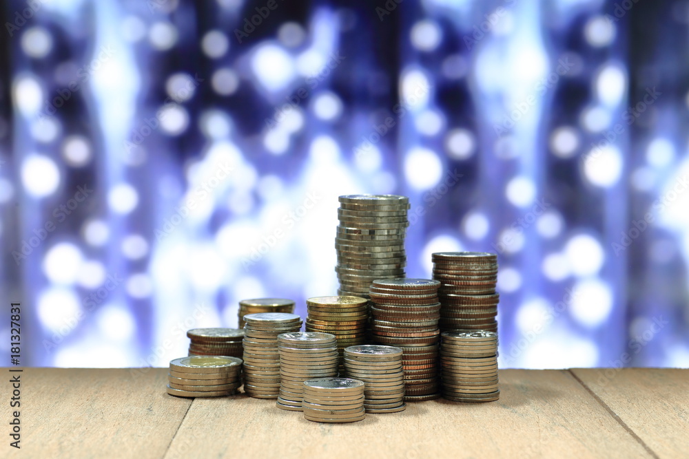 Poster coin stack with blur light dreamy bokeh background. business, finance and saving concept.