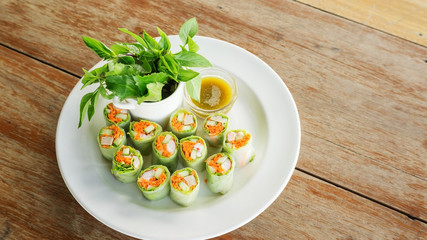 Fresh spring rolls with assorted vegetables with spicy sauce.
