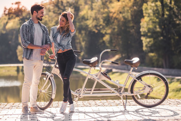 Couple with a tandem bicycle