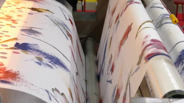 wallpaper in a roll on a drawing machine