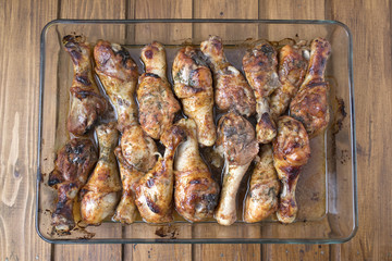 chicken legs on a transparent dish