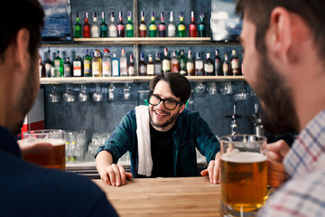 The bartender is working behind the bar