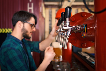 The bartender is working behind the bar