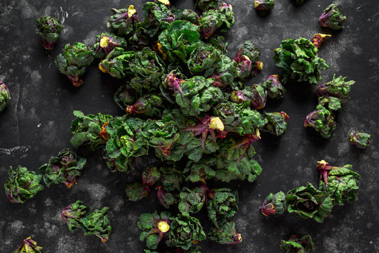 Fresh Raw Kalettes green vegetables on black background