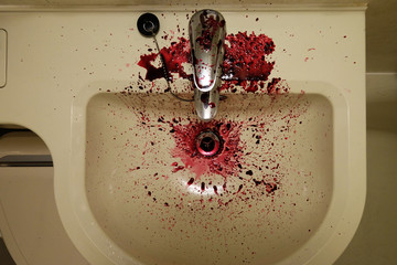 Top view of water sink stained by the red fruit juice