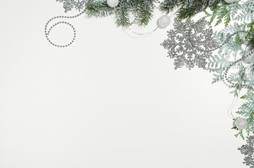 Christmas background frame top view on white seamless background with copy space around products. Decorations isolated on white. Horizontal and diagonal composition.
