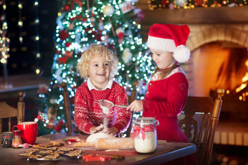 Child baking Christmas cookies. Kids bake for Xmas