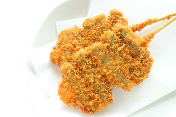 Japanese food, asparagus and bread crumb deep fried with bamboo skewer