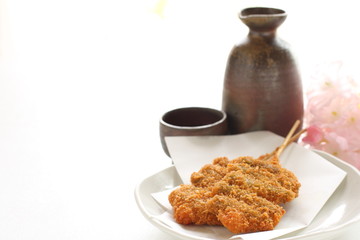 Japanese food, asparagus and bread crumb deep fried with bamboo skewer