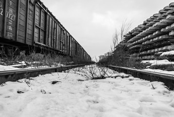 The abandoned railway in winter in black-white