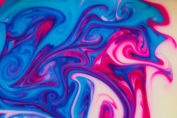 abstract patterns formed by mixing liquid paints..