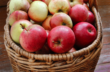 Bright tasty ripe apples in a basket