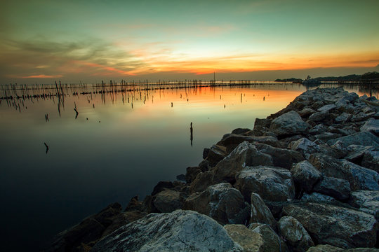 colorful sunset sky at abandoned sea coasta in bangpoo samuthprakarn thailand